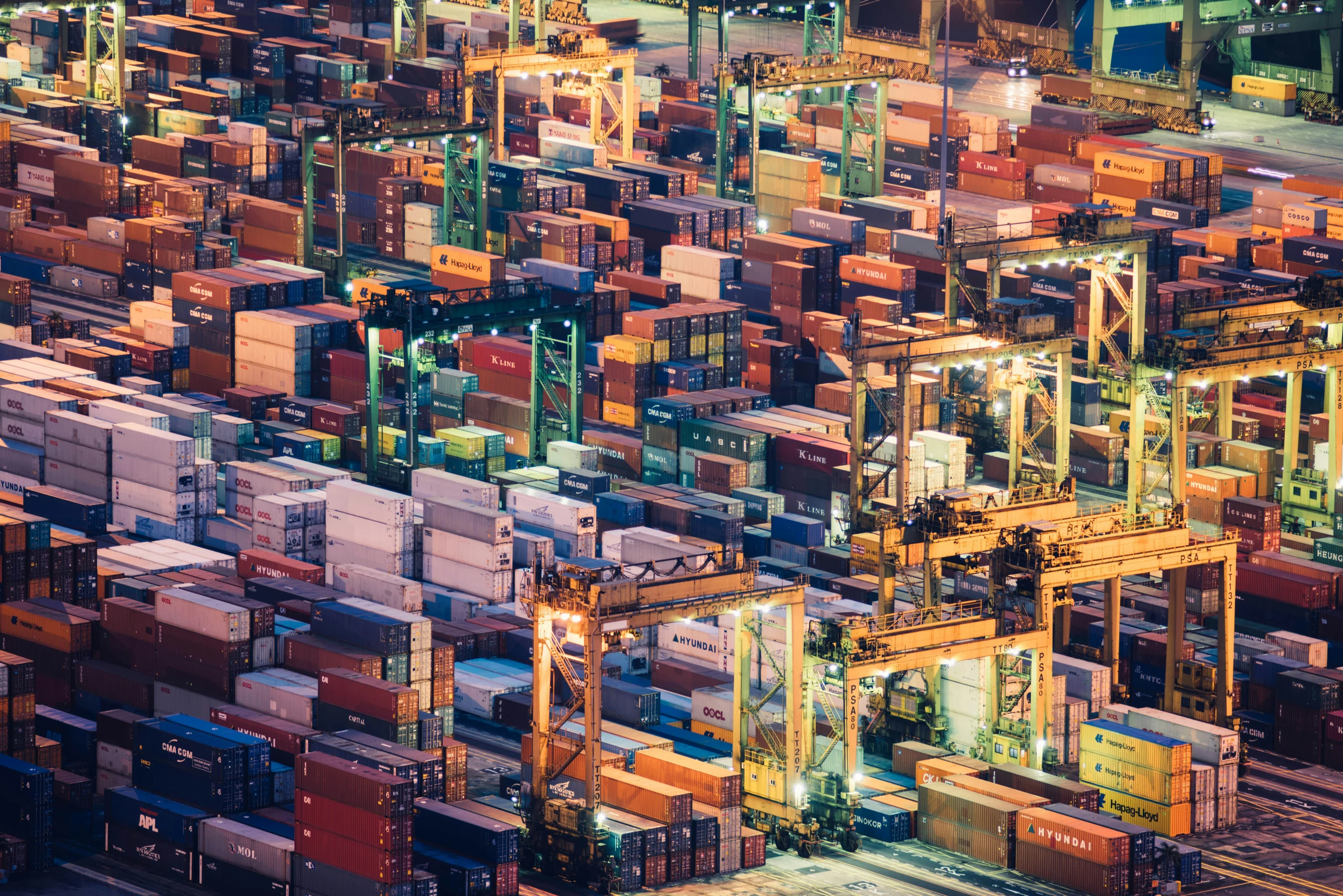 Aerial photograph of cargo containers and cranes at a working port