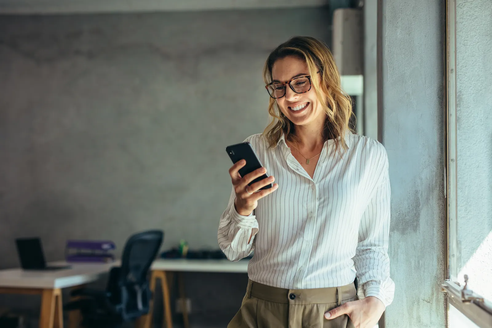 Professional checking a mobile task in the workplace